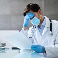 Frustrated Medical Doctor Mistake. Physician Report Paperwork