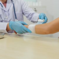 Doctor glove patient bandage wound care hospital medical treatment health