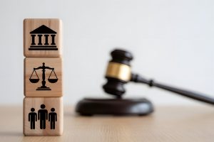 Family law and justice icons on wooden blocks with judge gavel